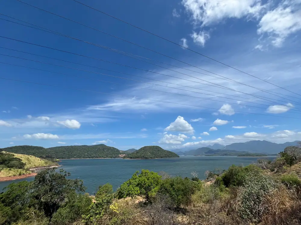 Winding hill country road from Ambuluwawa towards Kurunegala with lakes and mountains